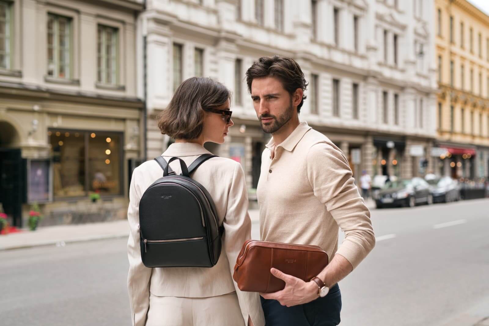 Arsante models with Backpack Mini in black and Toilet Bag in brown