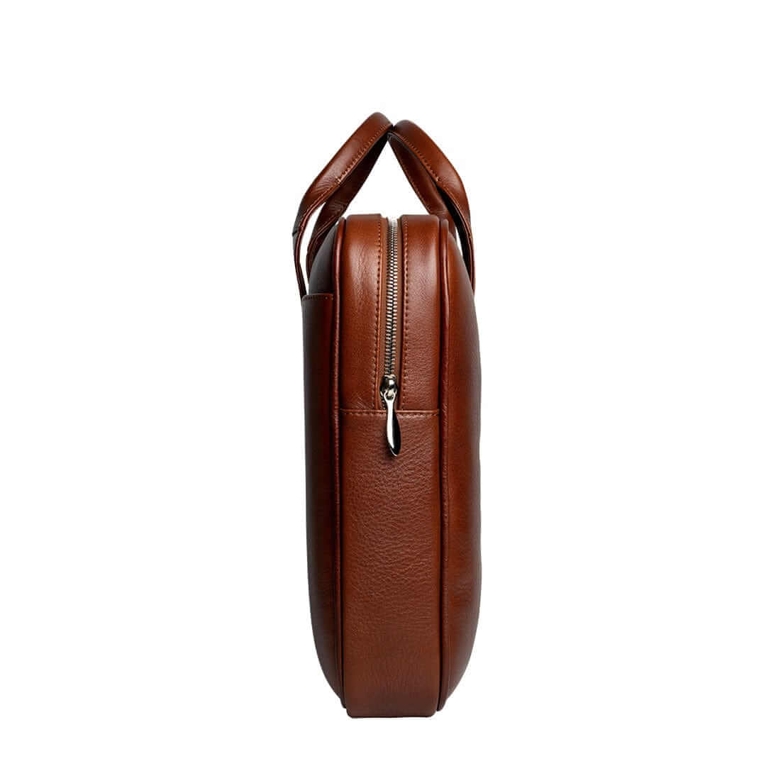 Close-up of the unique zipper puller on the Arsante Whisky Brown Briefcase, crafted from vintage aircraft metal for a blend of history and quality.