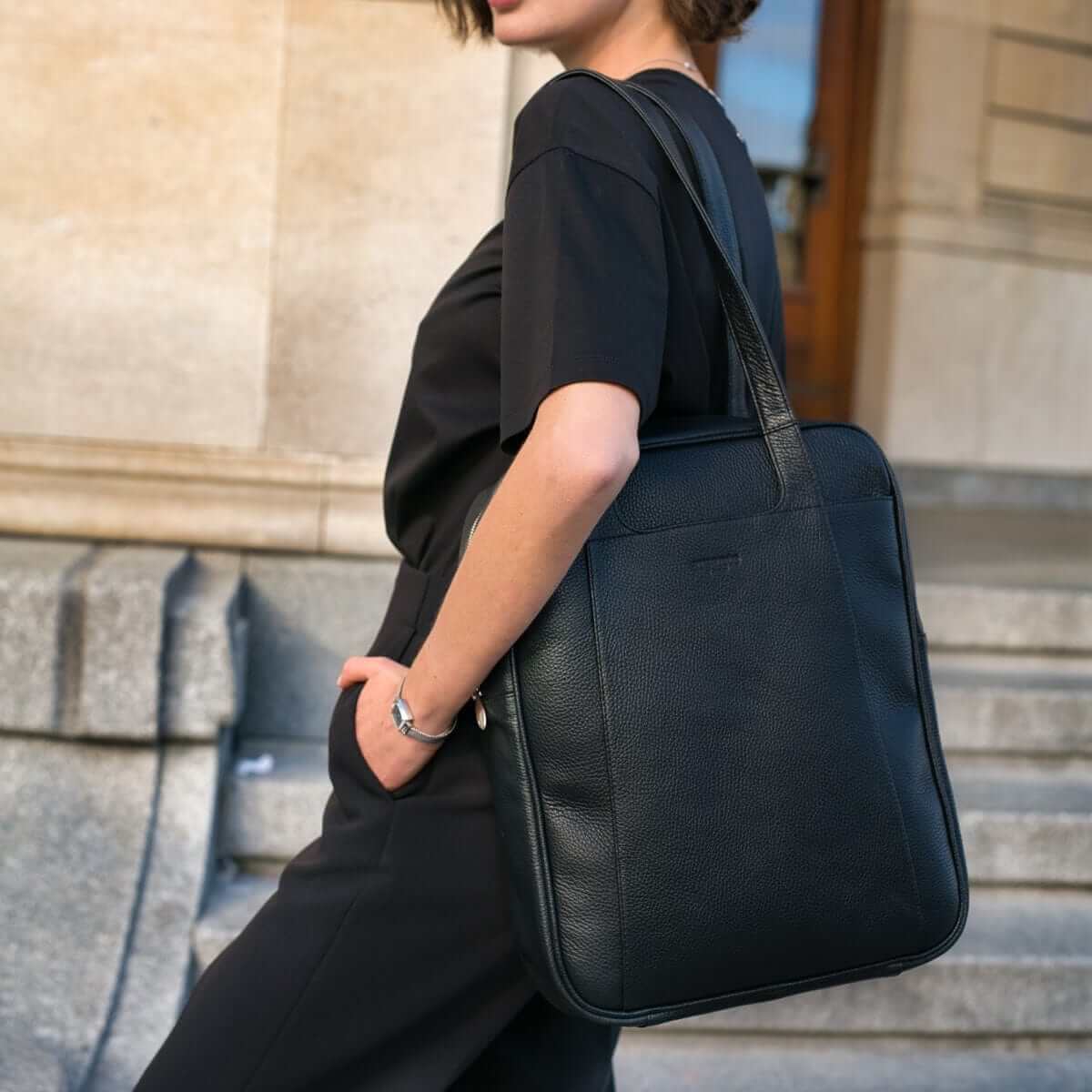 A stylish full-grain leather tote bag, the Arsante Iconica, with its long ergonomic shoulder straps, perfect for carrying all your essentials while travelling.