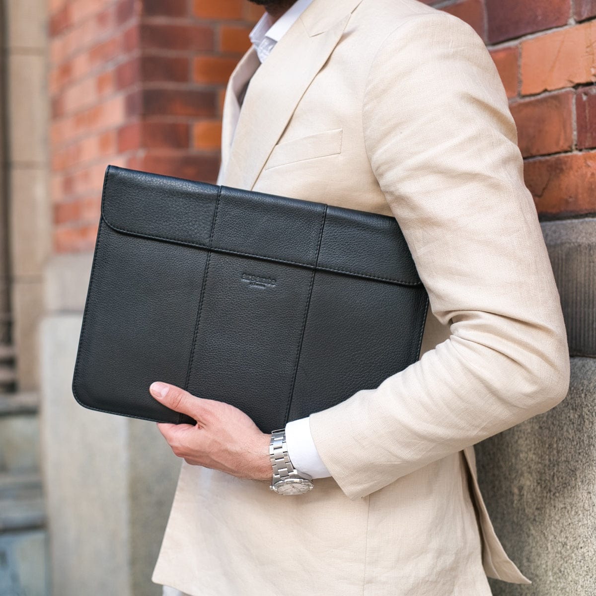 A close-up of the Arsante Laptop Sleeve with a secure magnetic closure.